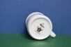 Dół kubka dla dzieci z  krecikiem i logiem Porcelán Thun
